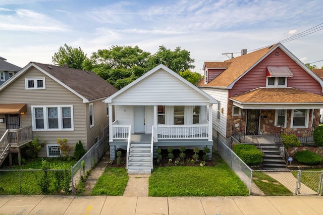 17 E 100th Pl, Chicago, IL 60628 - bungalow-style house featuring covered porch, stairway, and roof with shingles