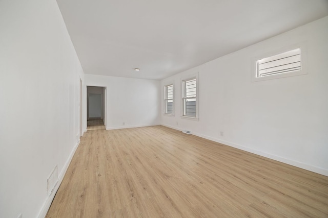 17 E 100th Pl, Chicago, IL 60628 - empty room with light wood-style floors and baseboards