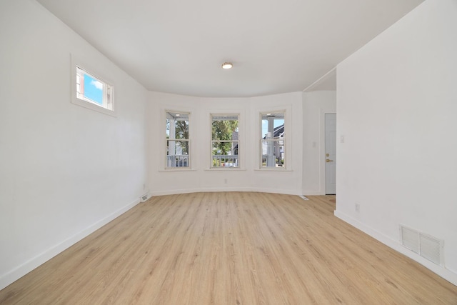 17 E 100th Pl, Chicago, IL 60628 - unfurnished room with light wood finished floors and baseboards