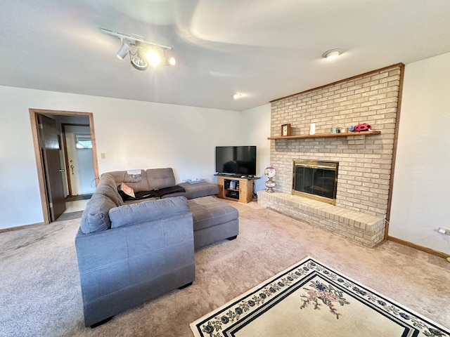 carpeted living room with a brick fireplace and baseboards