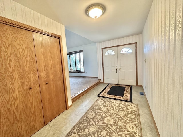 entrance foyer with light tile patterned floors