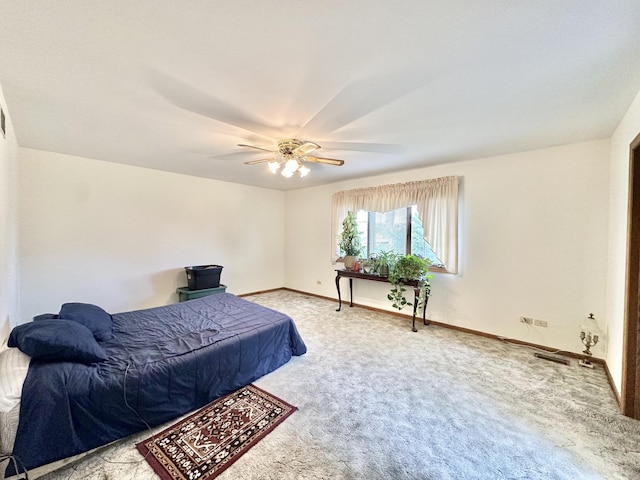 bedroom with carpet, baseboards, and a ceiling fan