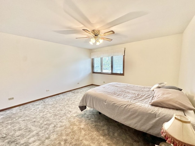bedroom with carpet flooring, baseboards, and ceiling fan