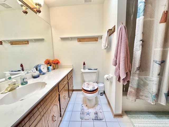 full bathroom with toilet, tile patterned flooring, vanity, and baseboards