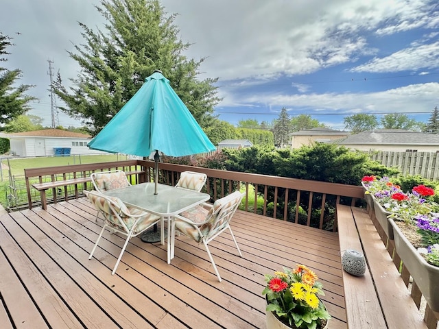 wooden terrace featuring outdoor dining area