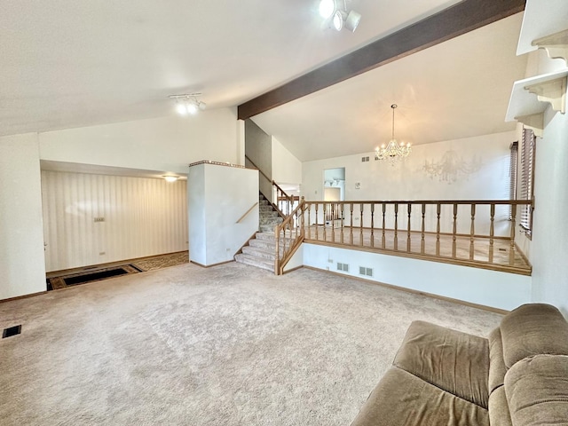 living room featuring carpet, a chandelier, baseboards, and stairs