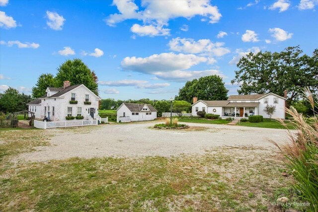 3N369 Lafox Rd, Saint Charles, IL 60175 - view of grassy yard featuring gravel driveway and covered porch