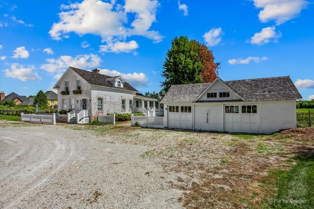 3N369 Lafox Rd, Saint Charles, IL 60175 - rear view of house with a chimney, a garage, an outdoor structure, and fence