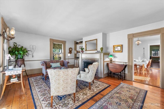 3N369 Lafox Rd, Saint Charles, IL 60175 - living area featuring light wood-type flooring, a fireplace, and baseboards