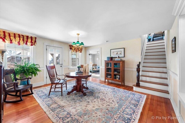 3N369 Lafox Rd, Saint Charles, IL 60175 - dining space featuring stairs, a chandelier, hardwood / wood-style floors, and wainscoting