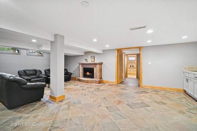 5654 N Manor Ln, Norwood Park, IL 60631 - living room featuring stone finish floors, a fireplace, and recessed lighting