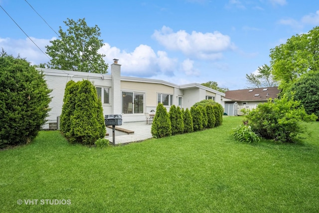 5654 N Manor Ln, Norwood Park, IL 60631 - back of property featuring a patio area, a yard, and a chimney