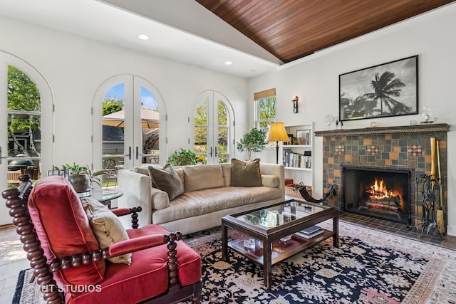2037 Highland Ave, Wilmette, IL 60091 - living room with lofted ceiling, wood ceiling, recessed lighting, a tiled fireplace, and french doors