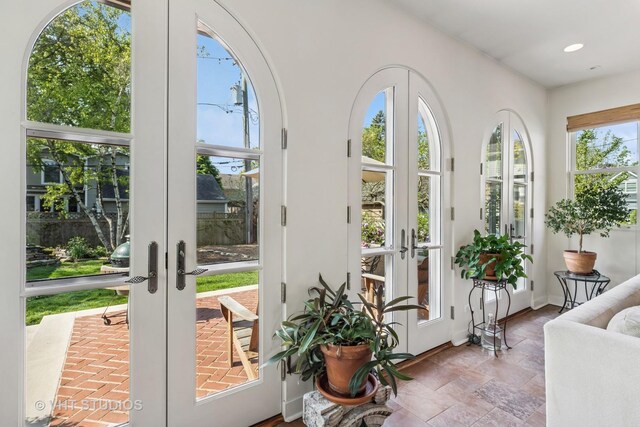 2037 Highland Ave, Wilmette, IL 60091 - entryway featuring french doors, stone finish flooring, recessed lighting, and baseboards