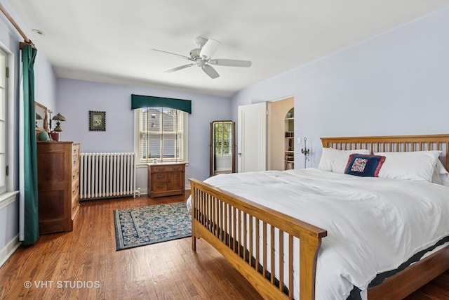2037 Highland Ave, Wilmette, IL 60091 - bedroom with radiator, wood finished floors, and ceiling fan