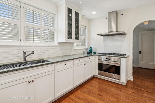 2037 Highland Ave, Wilmette, IL 60091 - kitchen with appliances with stainless steel finishes, wall chimney exhaust hood, a sink, backsplash, and recessed lighting