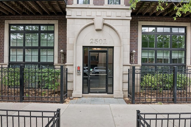 2501 N Sheffield Ave Unit 2S, Chicago, IL 60614 - property entrance with brick siding, a gate, and stone siding