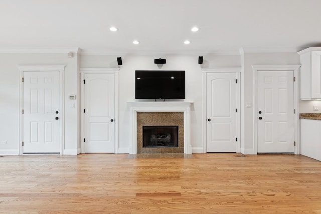 2501 N Sheffield Ave Unit 2S, Chicago, IL 60614 - unfurnished living room with recessed lighting, ornamental molding, a fireplace with flush hearth, light wood-type flooring, and baseboards