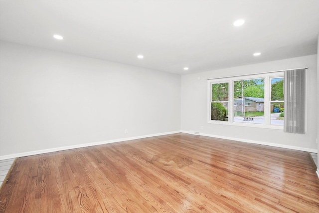 15245 Millard Ave, Midlothian, IL 60445 - empty room featuring recessed lighting, wood finished floors, and baseboards