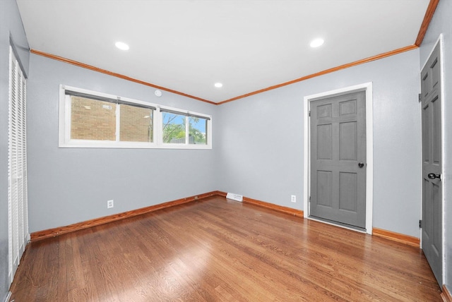 15245 Millard Ave, Midlothian, IL 60445 - unfurnished bedroom with crown molding, baseboards, wood finished floors, and recessed lighting