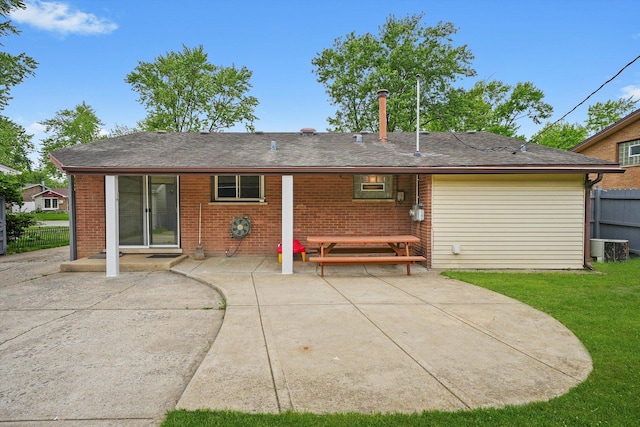 15245 Millard Ave, Midlothian, IL 60445 - rear view of property featuring a patio area, brick siding, and central air condition unit