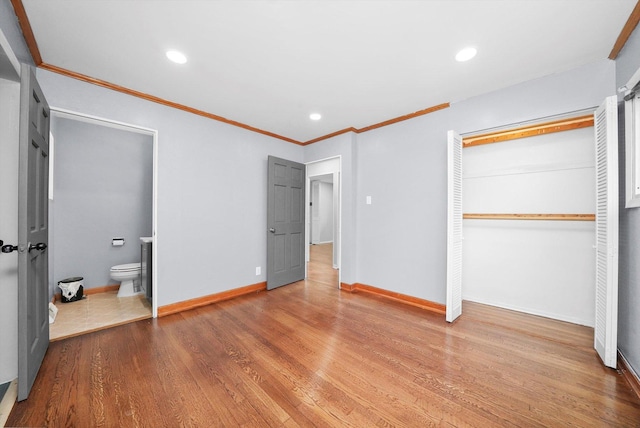 15245 Millard Ave, Midlothian, IL 60445 - unfurnished bedroom featuring a closet, baseboards, crown molding, wood finished floors, and recessed lighting