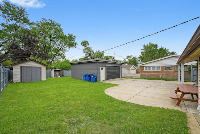 15245 Millard Ave, Midlothian, IL 60445 - view of yard featuring a detached garage and a patio