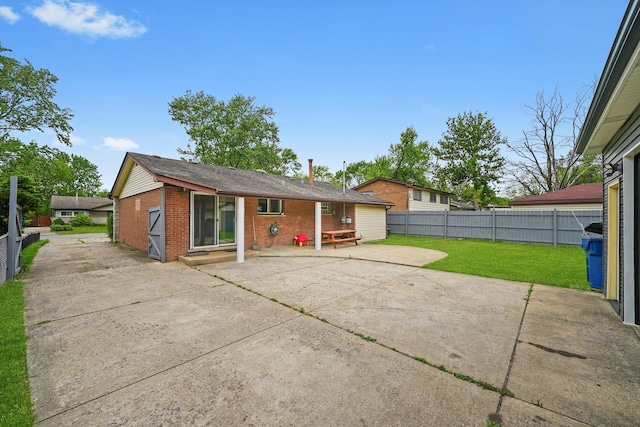 15245 Millard Ave, Midlothian, IL 60445 - rear view of house featuring a patio area and brick siding