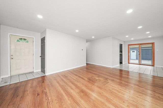 15245 Millard Ave, Midlothian, IL 60445 - unfurnished living room featuring light wood-style floors, recessed lighting, and baseboards