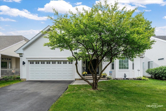 2488 Golf Trail Ct, Aurora, IL 60506 - view of property hidden behind natural elements with driveway, a garage, and a front yard