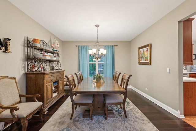 915 Eaton Ct, Lake Villa, IL 60046 - dining space with dark wood finished floors, a chandelier, and baseboards