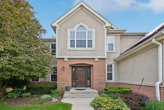 915 Eaton Ct, Lake Villa, IL 60046 - doorway to property with brick siding and stucco siding