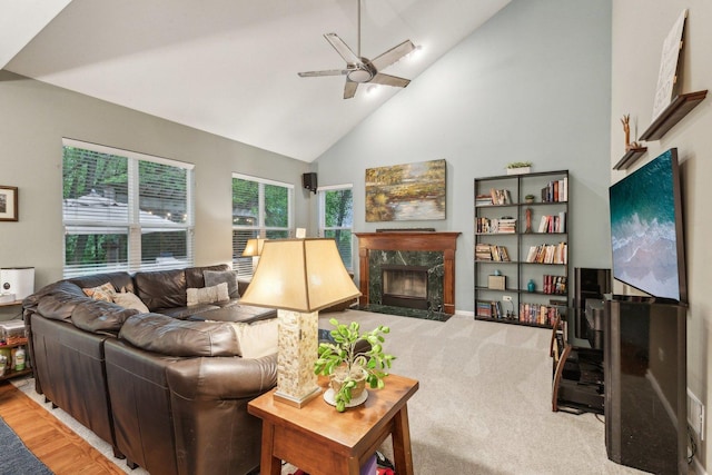 915 Eaton Ct, Lake Villa, IL 60046 - carpeted living room with a fireplace, a ceiling fan, and high vaulted ceiling