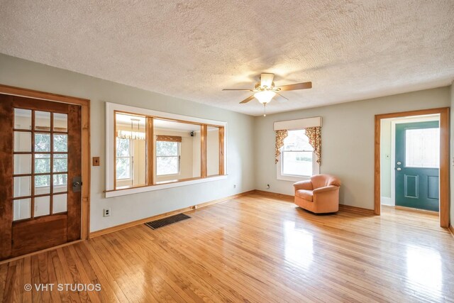 376 Douglas Ave, Crystal Lake, IL 60014 - entryway with wood finished floors, a ceiling fan, and a textured ceiling