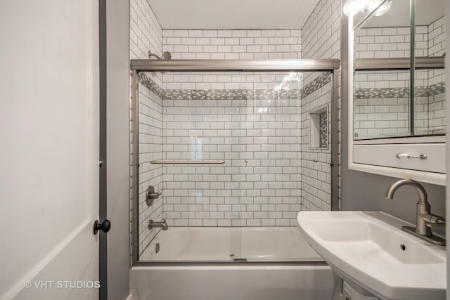 376 Douglas Ave, Crystal Lake, IL 60014 - bathroom featuring a sink and combined bath / shower with glass door