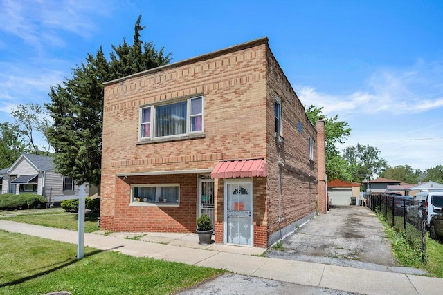 3724 W 135th St, Robbins, IL 60472 - townhome / multi-family property featuring brick siding, an outbuilding, and a garage