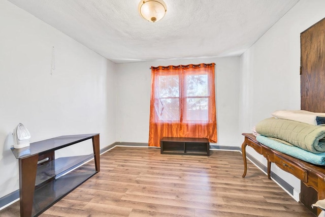 3724 W 135th St, Robbins, IL 60472 - sitting room featuring wood finished floors, baseboards, and a textured ceiling