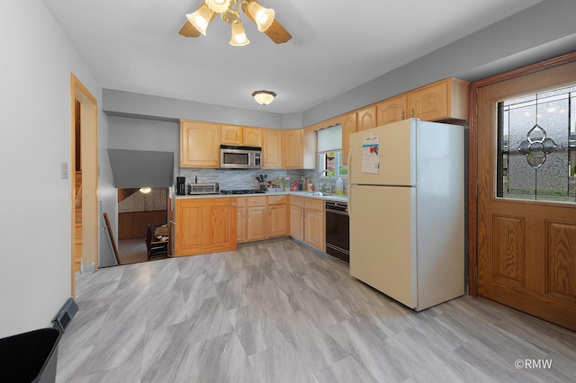 1236 N Fischer Dr, Addison, IL 60101 - kitchen featuring freestanding refrigerator, stainless steel microwave, light brown cabinets, and black dishwasher