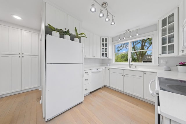 340 S Grant St, Westmont, IL 60559 - kitchen with white appliances, a sink, white cabinets, light countertops, and recessed lighting