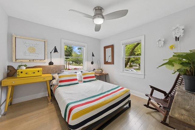 340 S Grant St, Westmont, IL 60559 - bedroom with multiple windows, light wood-style flooring, and a ceiling fan