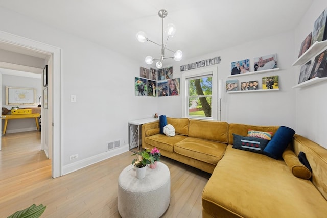 340 S Grant St, Westmont, IL 60559 - living area featuring light wood-style flooring, a chandelier, and baseboards