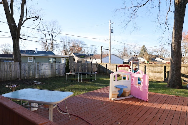 deck featuring a trampoline and a playground