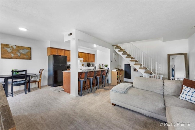 1565 Cornell Pl, Hoffman Estates, IL 60169 - living room with light colored carpet, stairs, and recessed lighting