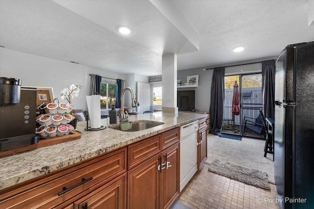 1565 Cornell Pl, Hoffman Estates, IL 60169 - kitchen featuring freestanding refrigerator, a sink, white dishwasher, light stone counters, and healthy amount of natural light