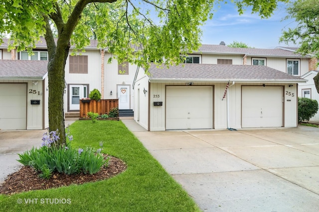 253 Edgewater Dr, Bloomingdale, IL 60108 - townhome / multi-family property with concrete driveway, a front yard, and roof with shingles