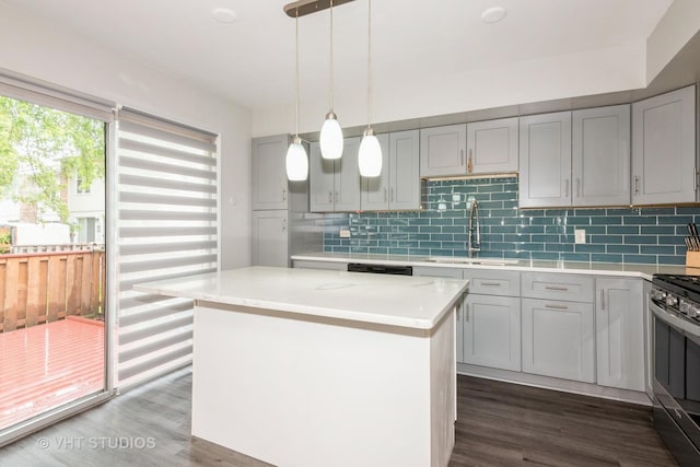 253 Edgewater Dr, Bloomingdale, IL 60108 - kitchen with gray cabinetry, stainless steel range, dark wood-style flooring, and decorative backsplash