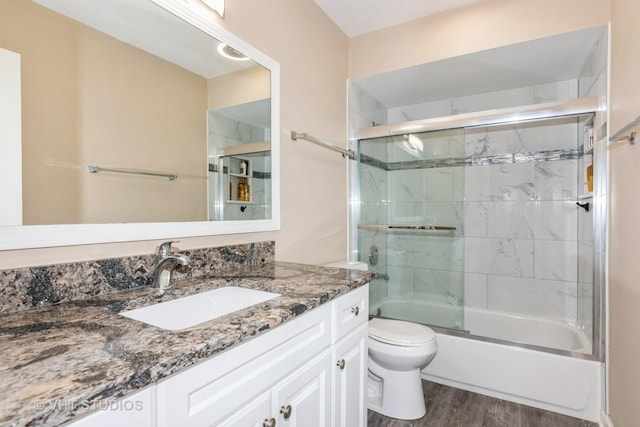 253 Edgewater Dr, Bloomingdale, IL 60108 - bathroom featuring vanity, wood finished floors, and enclosed tub / shower combo