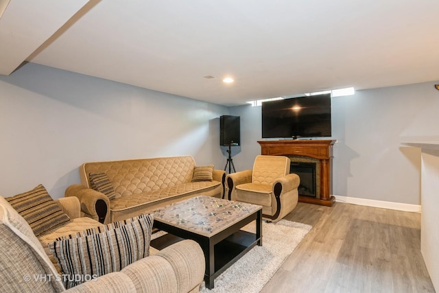 253 Edgewater Dr, Bloomingdale, IL 60108 - living area featuring light wood-type flooring, a glass covered fireplace, and recessed lighting