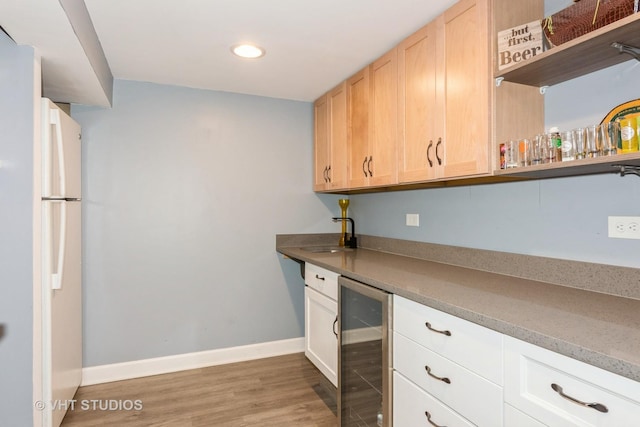 253 Edgewater Dr, Bloomingdale, IL 60108 - kitchen featuring beverage cooler, freestanding refrigerator, light wood-style floors, light brown cabinetry, and recessed lighting
