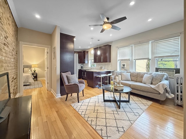 1325 W Addison St Unit 1A, Chicago, IL 60613 - living room featuring a ceiling fan, light wood-type flooring, cooling unit, baseboards, and recessed lighting